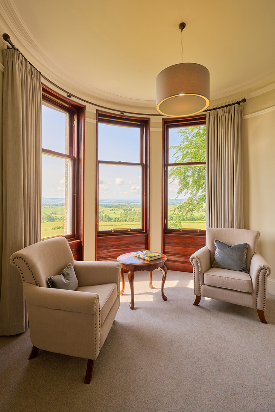 Tower bedroom of Kinclune House with view across countryside